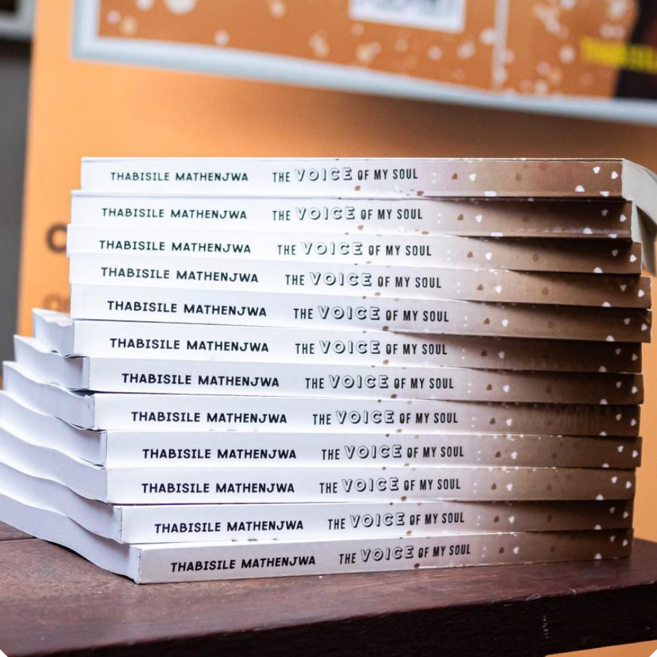 A stack of The Voice Of My Soul at the book launch